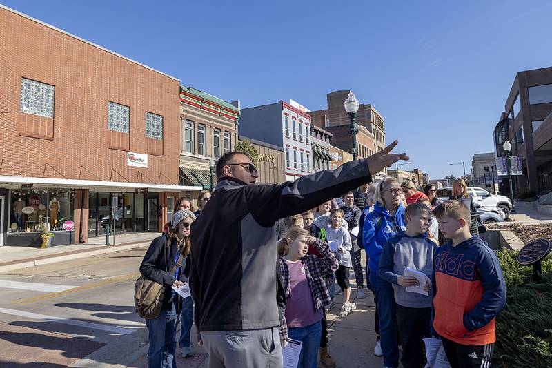 Alan Hulstedt, project manager for Larson and Darby Group of Rockford gestures while speaking with a group of fourth graders Tuesday, Nov. 1, 2022 about building characteristics. The group was on the annual architecture and history tour of downtown Dixon.