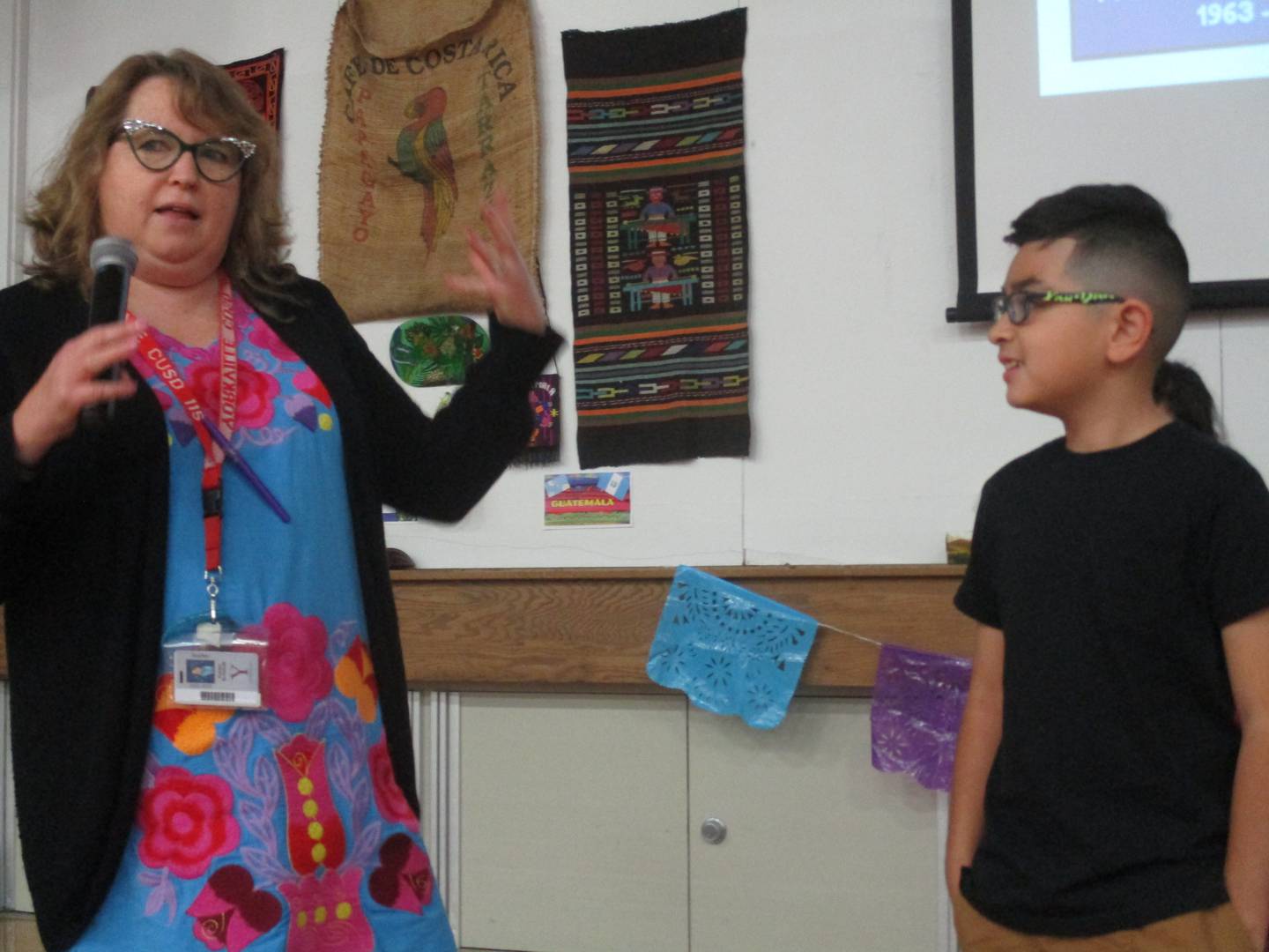 Yorkville Circle Center Grade School third-grade student Gabe Terrazas listens as English language teacher Karen Schmidt leads a school assembly celebrating Hispanic Heritage Month on Oct. 14, 2022.