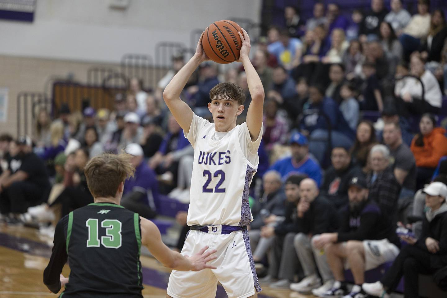 Dixon’s Bryce Feit looks to pass against Rock Falls Tuesday, Feb. 7, 2023.