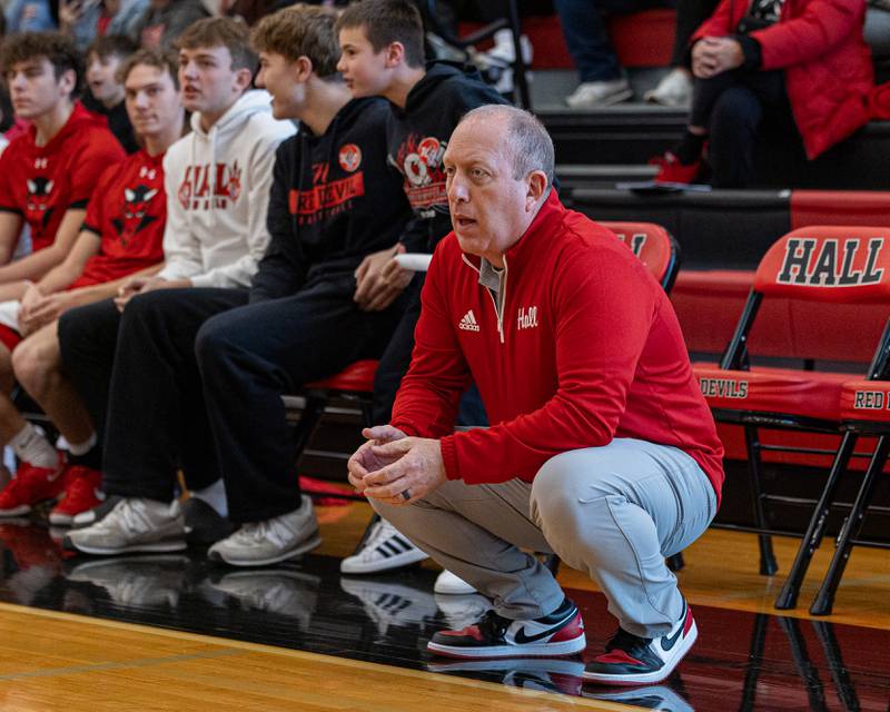 Hall Head Coach Mike Filippini crouches on sideline during game against St. Bede on Saturday, January 31, 2026 at Hall High School in Spring Valley.
