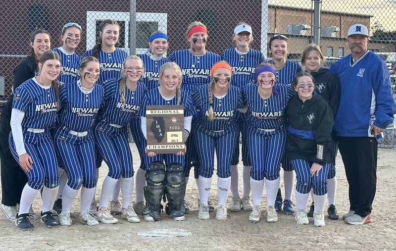 Members of the Newark softball team pose with the Class 1A Regional plaque after defeating Earlvilleon Thursday, May 22, 2025 at Indian Creek High School in Shabbona.