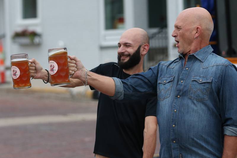 Jay Sharez of Princeton and Mike Jamen of Yorkville, compete in the beer stein competition during the Oktoberfest event on Saturday, Oct. 18, 2025 at Rotary Park in Princeton.