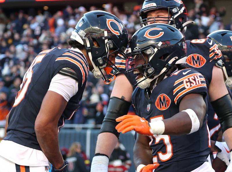 Chicago Bears running back Kyle Monangai (right) celebrates his touchdown with wide receiver Rome Odunze Sunday, Nov. 23, 2025, during their game at Soldier Field in Chicago.