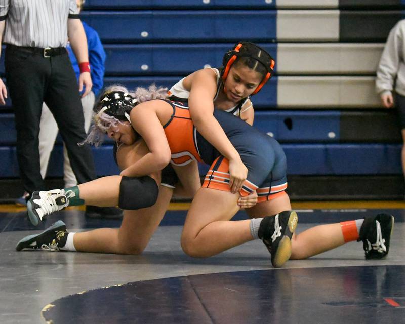 Julissa Haines of Oswego, front, Laila Cuadra of St Charles East wrestles on Saturday Jan. 4, 2024, in the135 weight class during the Aaron Dudley invite held at Oswego East High School.
