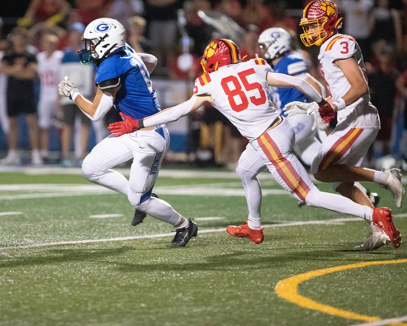 Geneva's Brain Waters runs the ball as Batavia's defense looks for the stop on Friday, Oct. 3, 2025 in Geneva.