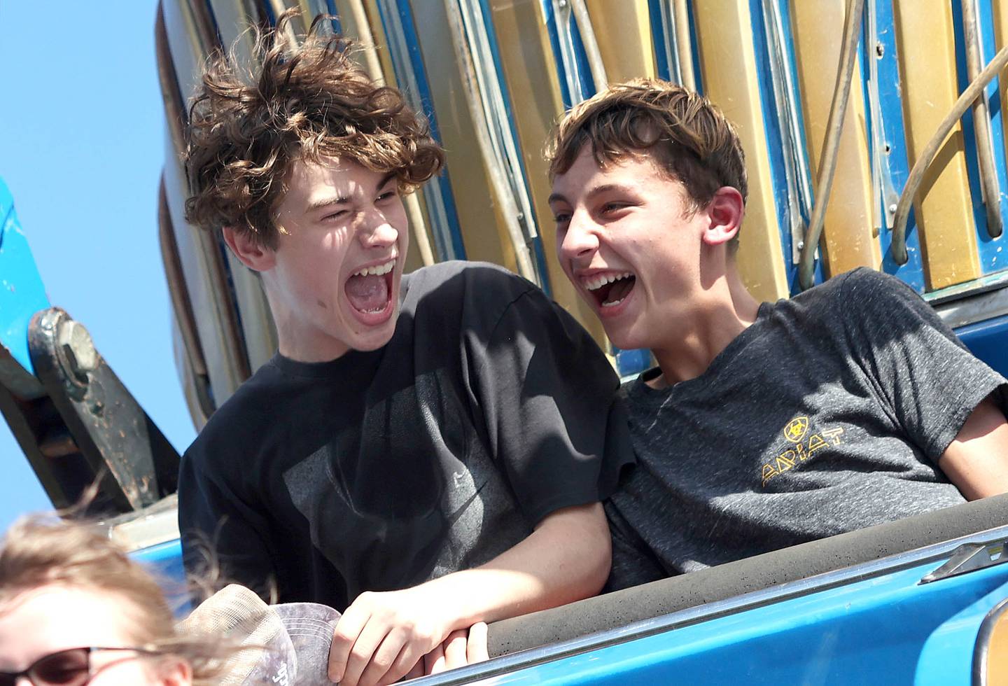 Liam Forde, (left) 15, from Waterman, and Braeden Gosnell, 13 from Shabbona, ride Pharaoh's Fury in the carnival area Friday, Aug. 26, 2022, during Corn Fest in downtown DeKalb.