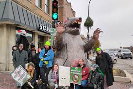 Starbucks’ baristas strike, picket Geneva location with giant rat