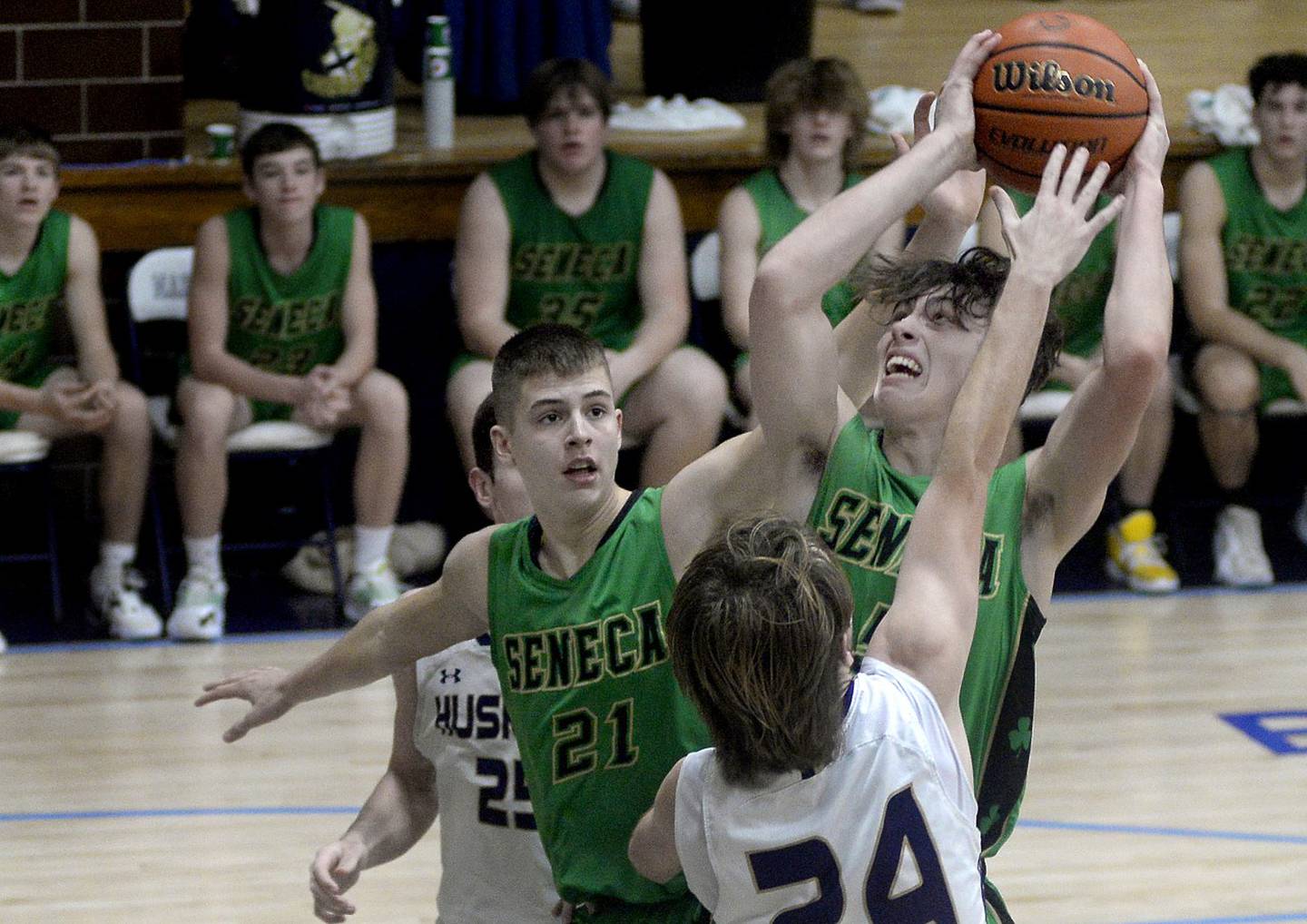 Seneca’s Kysen Klinker gets a shot off over the block attempt by Serena’s Camden Figgins in the fourth quarter of Wednesday's semifinal game of the Marquette Christmas Tournament. - 12/28/22