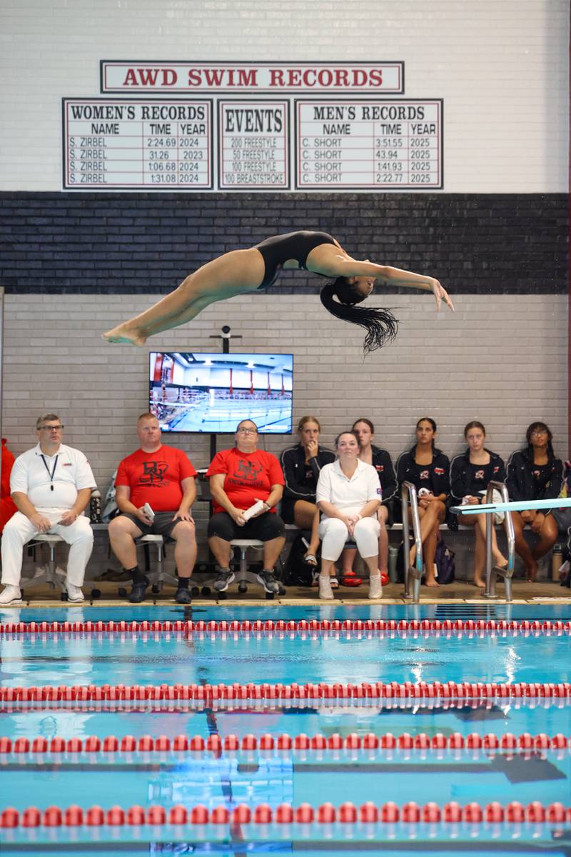 Bradley-Bourbonnais' Ashley Smith performs a dive during Bradley-Bourbonnais' victory over Kankakee and Bishop McNamara in the All-City swim meet on Tuesday, Sept. 9, 2025.