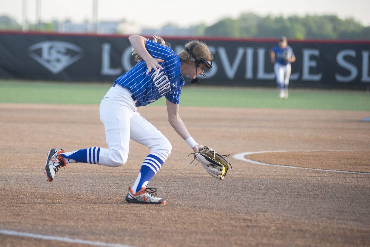 St Charles North’s Julia Larson fields a ball at third against Edwardsville Friday, June 10, 2022 in the class 4A IHSA state softball semifinal game.