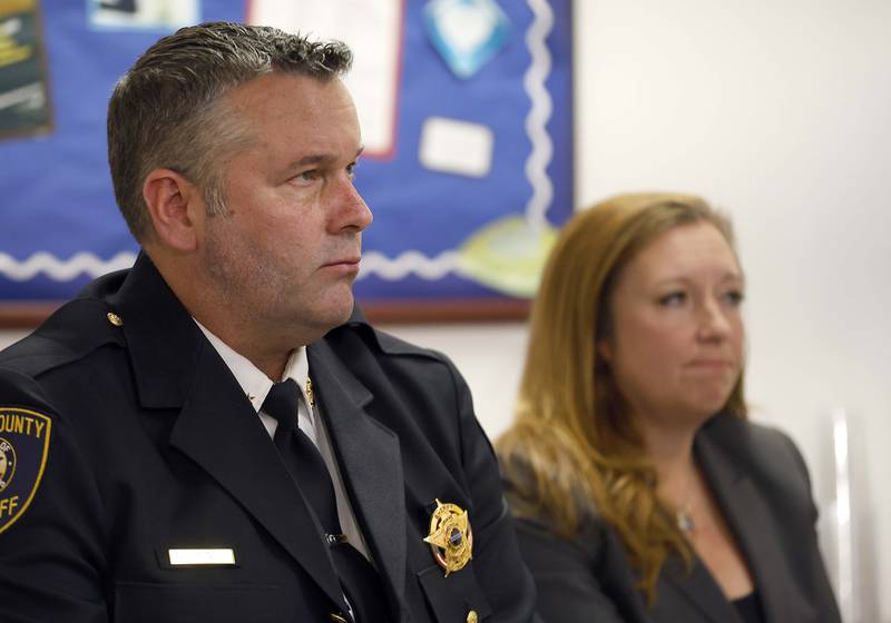 Kane County Sheriff Ron Hain and Kane County State's Attorney Jamie Mosser watch body and vehicle cameras during a press conference Friday, April 11, 2025 at the Kane County Sheriff's Office in St. Charles Ill from an altercation where three Kane County deputies were justified when they shot and killed James Moriarty on May 24, 2023 on Randall Road in Batavia.