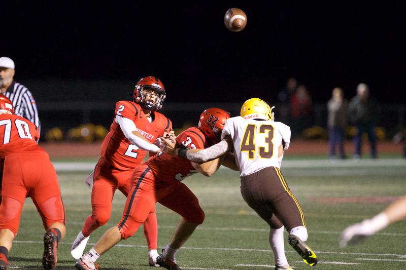 Huntley's Sam Deligio throws a pass for a gain against Jacobs on Friday, Sept. 23,2022 in Huntley.