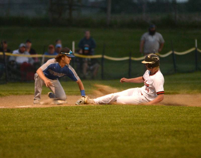 Newman's Garet Wolfe tags out the second Pearl City runner who attempted to steal third at the 1A Pearl City Sectional on Wednesday, May 24.