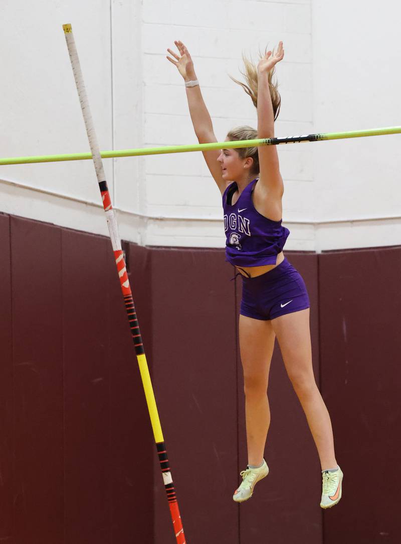 Downers Grove North's McKenna Purgatorio smiles as she clears the bar in the pole vault during the girls varsity track and field 3A Lockport sectional on Friday, May 12, 2023.