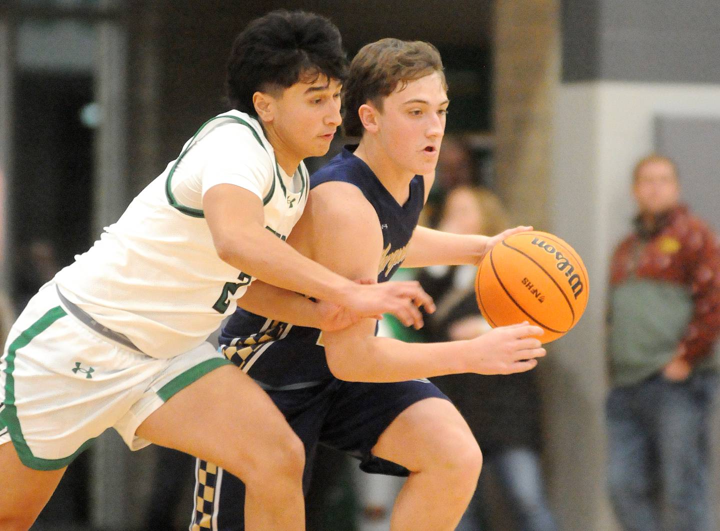 Marquette junior guard Griffin Dobberstein pushes down the court past the defense of Seneca junior guard Jesus Govea on Friday, Dec. 5, 2025 at Seneca High School. Dobberstein tied his career high of 28 points.