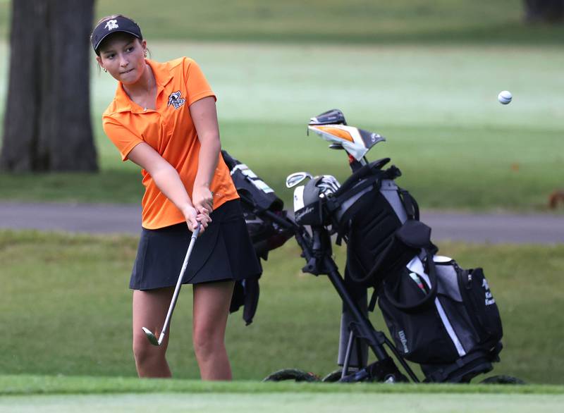 Kaneland’s Kailey Kunstman chips onto the first green Tuesday, Sept. 23, 2025, during the Interstate 8 girls golf meet at the Sycamore Golf Club.