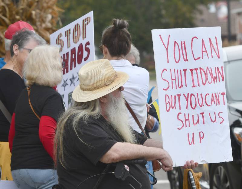 There were a variety of signs carried by demonstrators on Saturday, Oct. 18, 2025 at the No Kings rally on the Ogle County Courthouse square in Oregon, Illinois to protest actions and decisions by President Donald Trump and his administration.