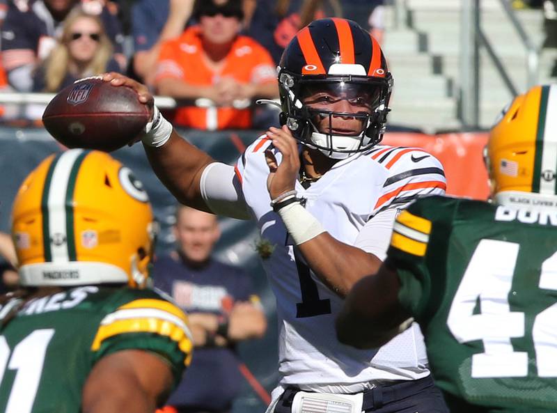 Chicago Bears quarterback Justin Fields throws a pass over the Green Bay Packers defense during their game Sunday, Oct. 17, 2021, at Soldier Field in Chicago.