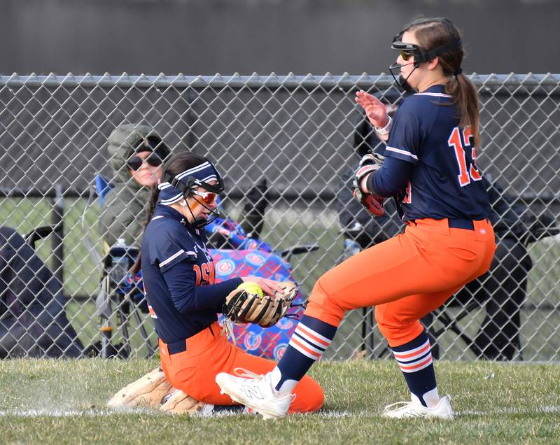 Oswego’s Rhiana Martinez (left) makes a sliding catch in foul territory in front of teammate Leah McKenzie during a game against Wheaton Warrenville South on April 10, 2025 at Wheaton Warrenville South High School in Wheaton.