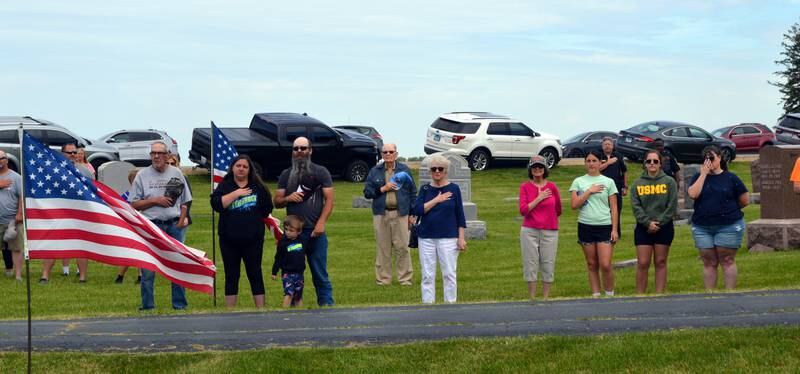 Polo residents recite the Pledge of Allegiance in Fairmount Cemetery, located just north of the city, during a Memorial Day ceremony on May 29, 2023. The ceremony was held following a parade that started on East Mason Street and ended at Fairmount Cemetery.