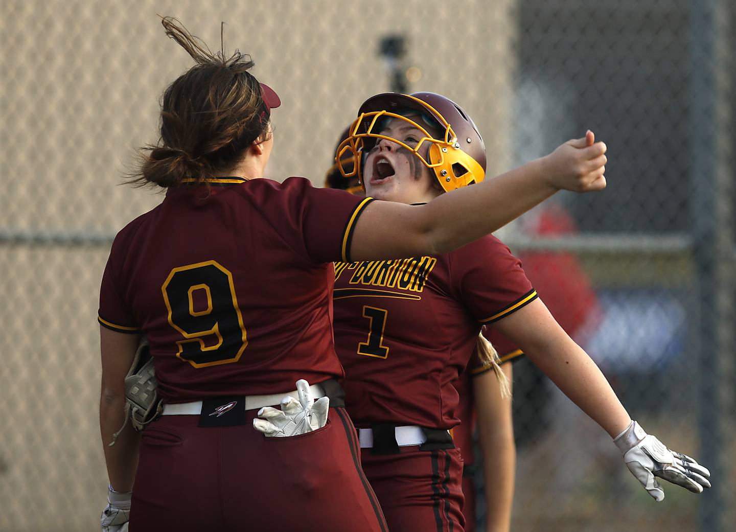 Richmond-Burton's Norah Spittler, left, and Lyndsay Regnier celebrate Regnier scoring a run during a nonconference softball game Wednesday March 16, 2022, between Crystal Lake Central and Richmond-Burton at Lippold Park in Crystal Lake.