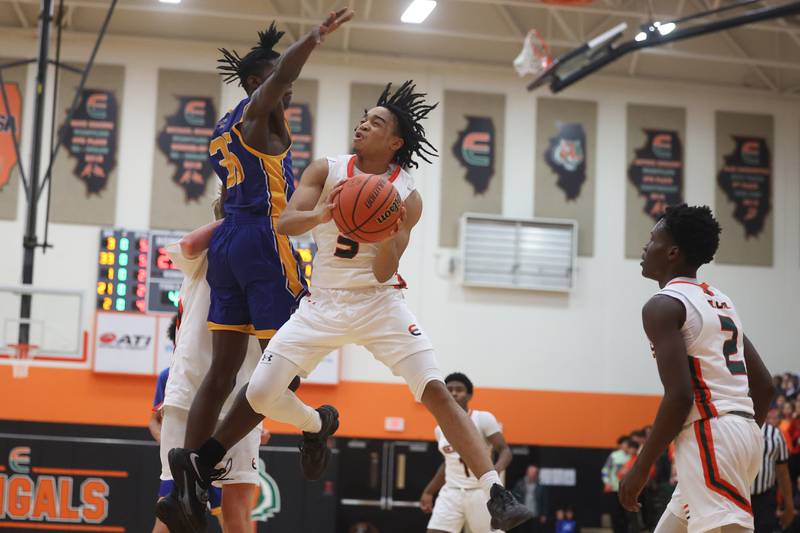 Plainfield East’s James Jones III finesses a shot against Joliet Central.
