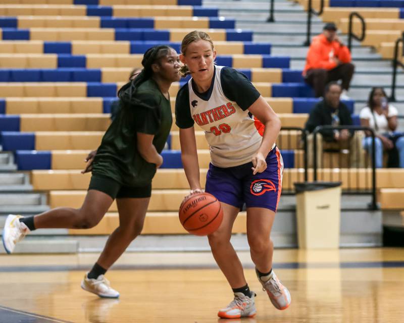 Oswego's Peyton Johnson drives baseline at the Oswego girls basketball shootout tournament. June 28, 2024.