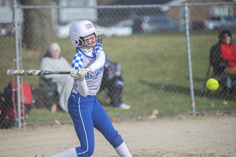 Newman's Maddy Duhon drives the ball to right field for a single Wednesday, April 6, 2022 against Bureau Valley.