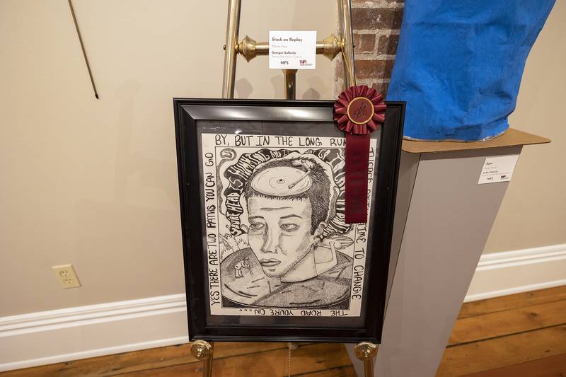 Sterling High School senior Georgia Gallardo received a 3rd place award for “Stuck on Replay,” Friday, March 28, 2025, for the student art show at The Next Picture Show in Dixon.