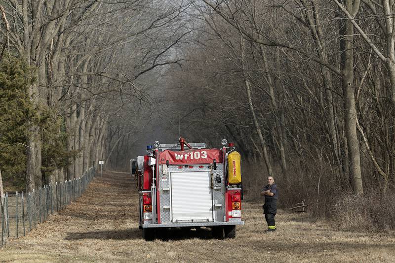 Local departments stage Friday, March 14, 2025, near Green River State Wildlife Area as a wild fire scorches the park.