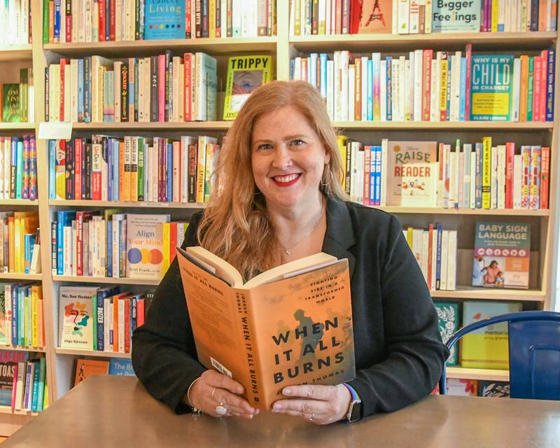 Jen Hall poses for a photo on Friday Oct. 3, 2025, at the Harvey’s Tales bookstore in Geneva.