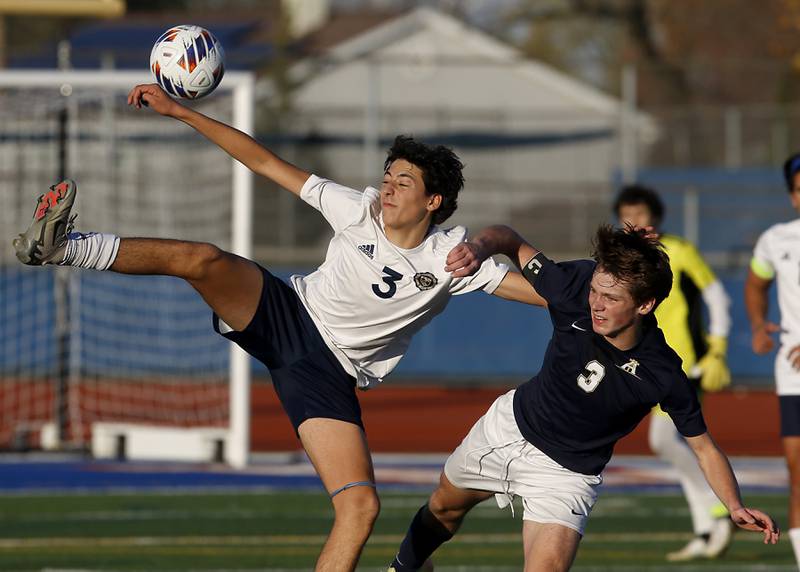 Lemont's Vincenzo Mancini kicks the ball as he fights for position against Belleville Althoff Catholic's Jack Sorgea during an IHSA Class 3A state semifinal soccer match on Friday, Nov. 8, 2024, at Hoffman Estates High School.