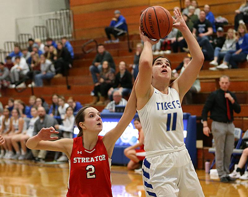 Princeton's Olivia Gartin (11) pulls up in the lane to shoot a jump shot over Streator's Kiley Rhodes (2) in the Lady Tigers Holiday Tournament on Tuesday, Nov. 15, 2022 in Princeton.