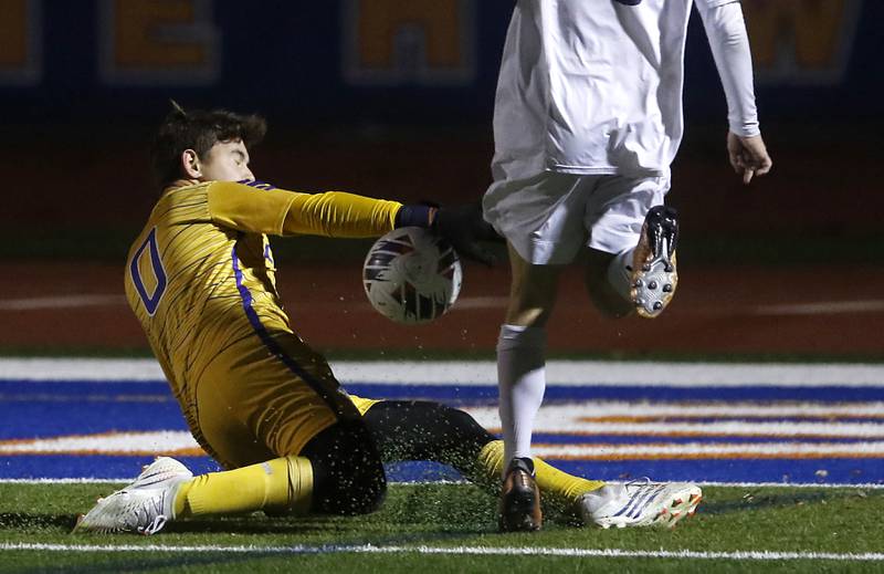 Lyons Township's Tyler Balon plays the ball as nt8\ tries to score during the IHSA Class 3A state championship soccer match on Saturday, Nov. 4, 2023, at Hoffman Estates High School.