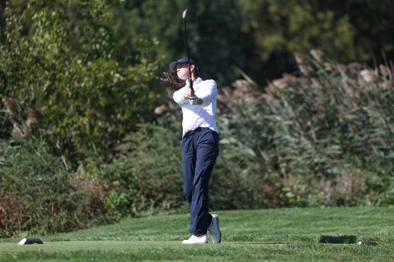Oswego East’s Alli Wiertel tees off the seventh hole at the Class 2A Plainfield North Regional at Whitetail Ridge Golf Course.