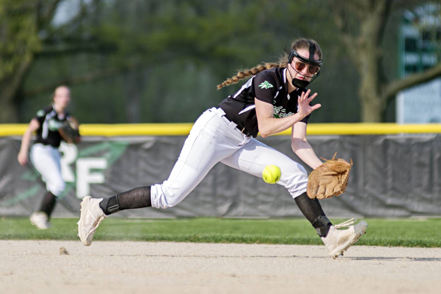 Rock Falls' Rylee Johnson snags a grounder in the gap for an out against Dixon on May 10, 2022.