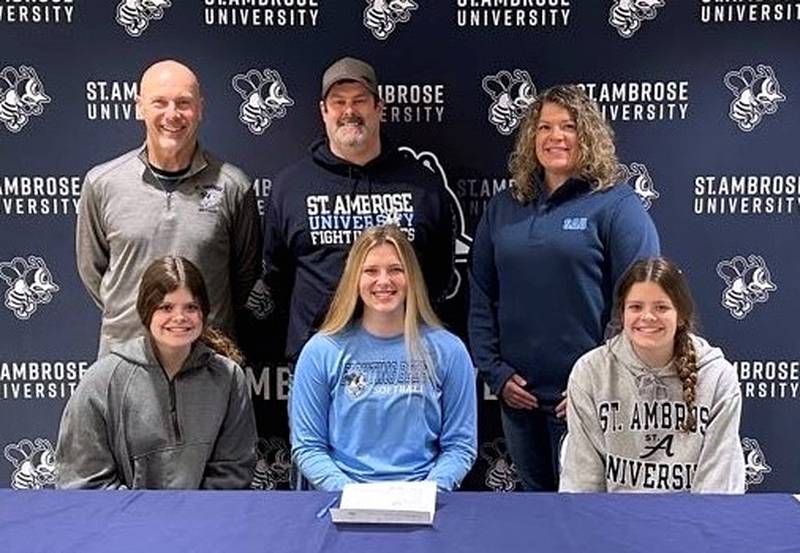 La Salle-Peru senior Laurel Politsch (seated, center) signed to play softball at St. Ambrose University. She was joined by (seated) Meredith Politsch and Gracie Politsch and standing (left to right) St. Ambrose coach John Kelly, Chris Politsch and Andrea Politsch. At St. Ambrose, Politsch plans to major in forensic psychology.