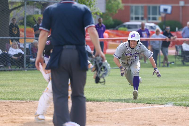 Wilmington's Shawn James prepares to slide into home for a run during the Wildcats 7-2 victory over Chicago Christian in the IHSA Class 2A Beecher Sectional semifinal on Thursday, May 29, 2025.