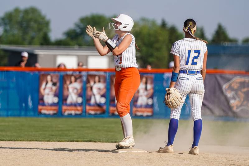 Oswego’s Kennedy Gengler (9) smiles after hitting a two run double against Wheaton North during a Class 4A Oswego Sectional Final game at Oswego High School on Friday, June 6, 2025.