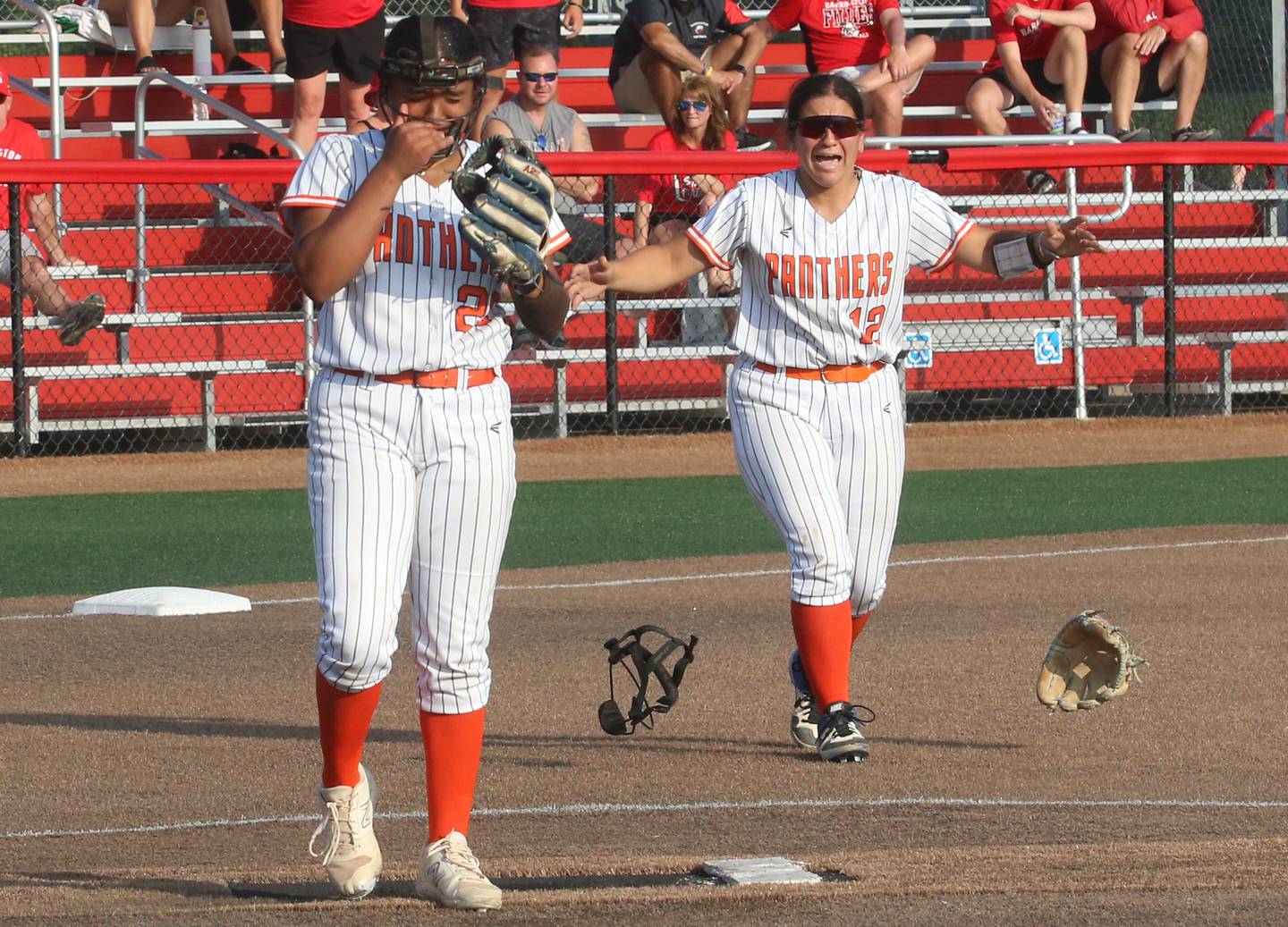 Oswego's Jaelynn Anthony reacts with teammate Aubriella Garza after winning the Class 4A championship against Barrington on Saturday, June 14, 2025 at the Louisville Slugger Sports Complex in Peoria.