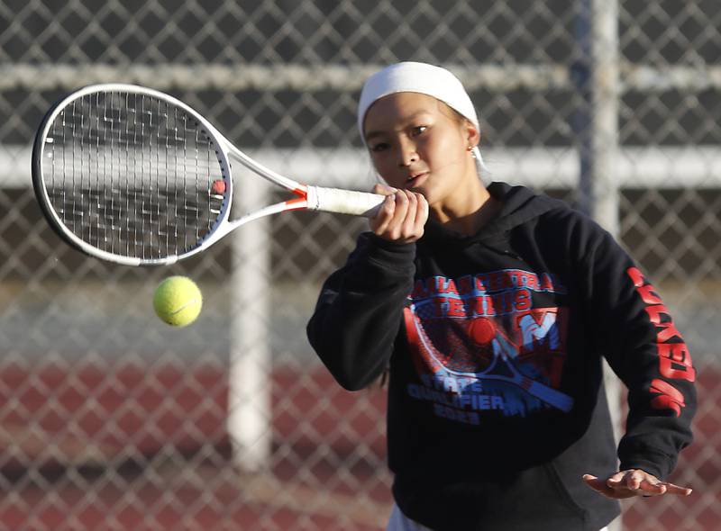 Marian Central’s Jordan Cheng returns the ball Thursday, Oct. 23, 2025, during the first day of the IHSA State Girls Tennis Tournament at Schaumburg High School.