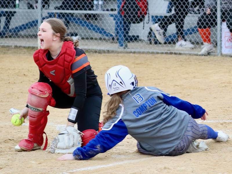 Kewanee catcher Kieryn Abernathy reacts after tagging out Princeton's Taylor Compton Thursday at Little Siberia.