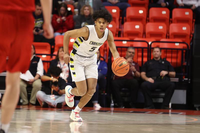 Yorkville Christian’s Tyler Burrows works the ball up court against Liberty in the Class 1A championship game at State Farm Center in Champaign. Friday, Mar. 11, 2022, in Champaign.