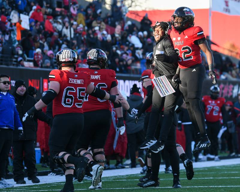 Northern Illinois University’s Telly Johnson Jr., right, celebrates with NIU sidelines after scoring a touchdown during the game on Saturday Nov. 30, 2024, while taking on Central Michigan held at Huskie Stadium in DeKalb.