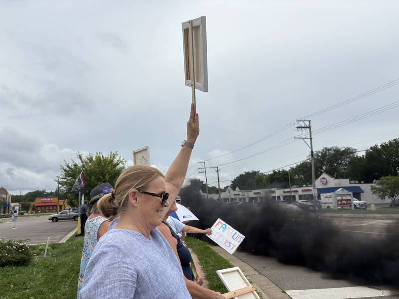A vehicle rolls coal during a protest against President Trump July 26, 2025 in McHenry.