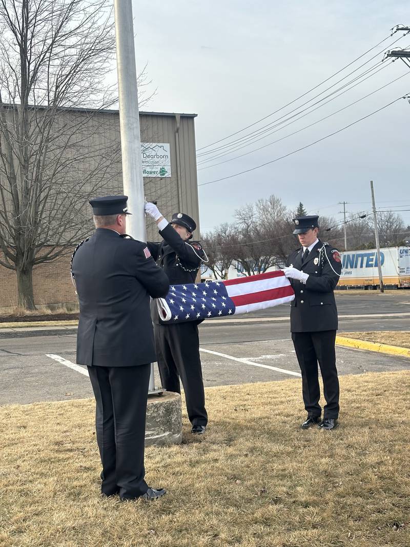 Sycamore firefighters hoist the American flag at an opening ceremony on Tuesday, Feb. 17, 2026, to mark the opening of the Sycamore Fire Department's new fire station, 1351 S. Prairie Drive.  The station will replace the aging building at 535 DeKalb Ave.