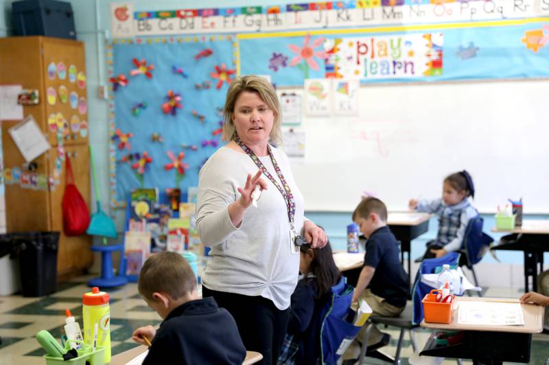 Lori McNaught works with her kindergarten class at St. Matthew Parish School in Glendale Heights.