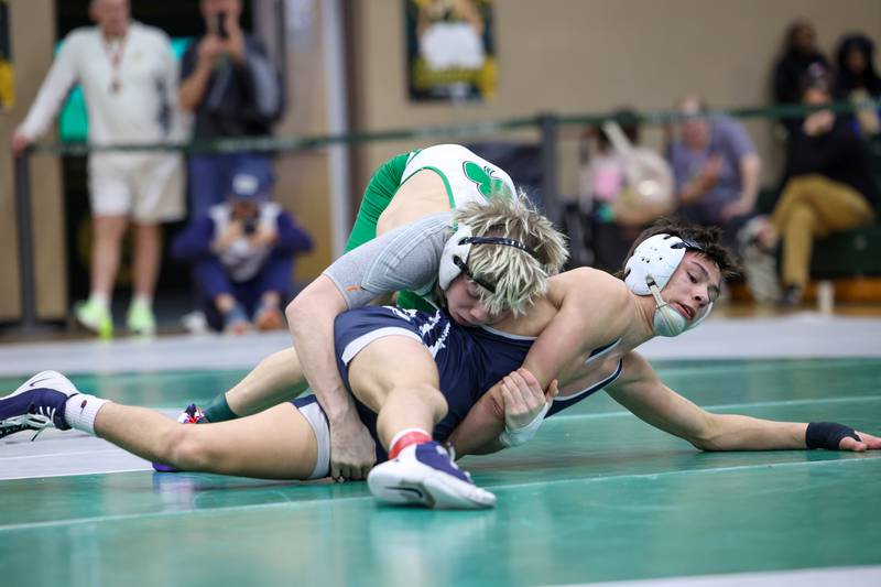 Seneca's Raiden Terry, top, wrestles Chicago Hope Academy's Nolan Callahan in the 120-pound championship match during the IHSA Class 1A Coal City Sectional on Saturday, Feb. 14, 2026.