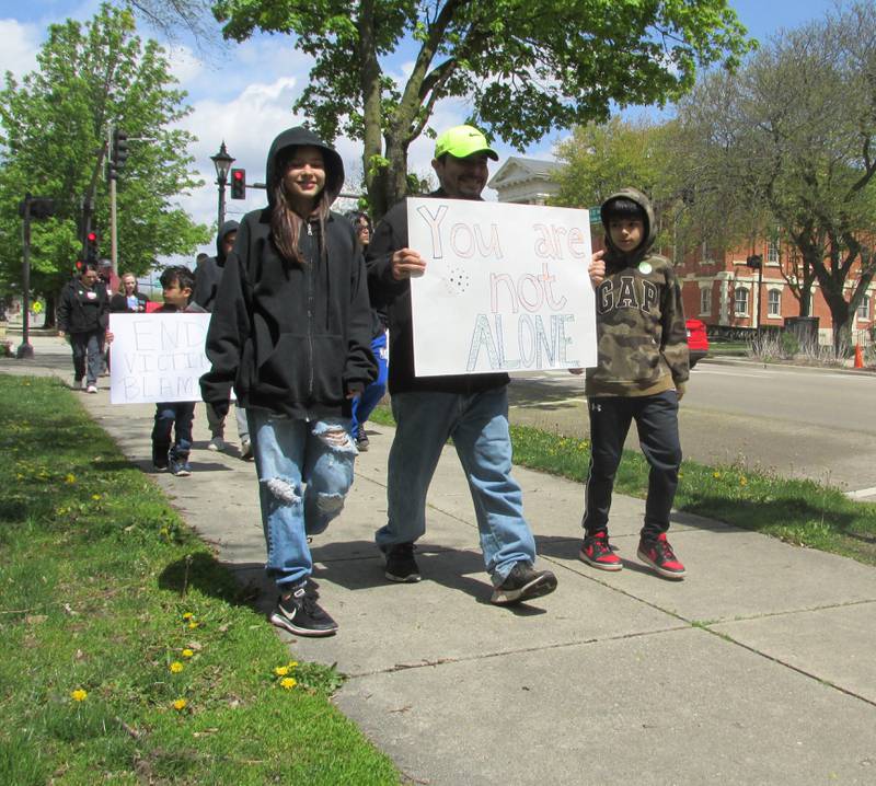 Dozens participate in the March to Believe organized by Safe Journeys on Saturday, April 29, 2023, at Washington Square in Ottawa.