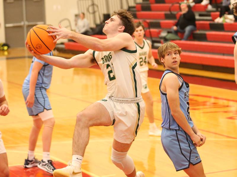 St. Bede's Gus Burr darts to the hoop around Bureau Valley's Brandon Carrington during the 50th annual Colmone Classic on Thursday, Dec. 12, 2024 at Hall High School.